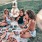 Women in the park eating at a picnic