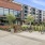 Exterior view of building with bike rack & dog park at Eclipse