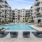 Pool deck with outdoor grilling & fire pit at Eclipse Huntsville