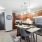 Kitchen with wood plank flooring and stainless steel appliances featuring dishwasher, oven, refrigerator, and microwave